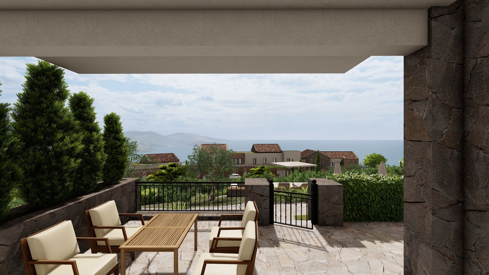 Terrace with garden furniture and panoramic sea view at the Lustica Bay residential complex, Luštica, Montenegro.
