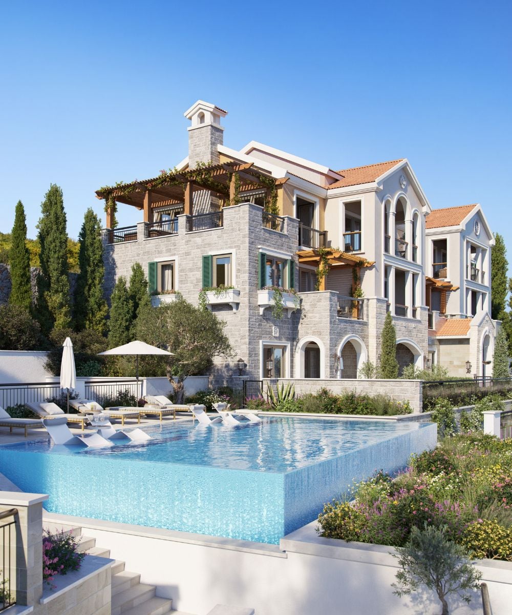 Luxury villa with a pool and terrace in the Luštica Bay residential complex, Montenegro: view of the facade and relaxation area.