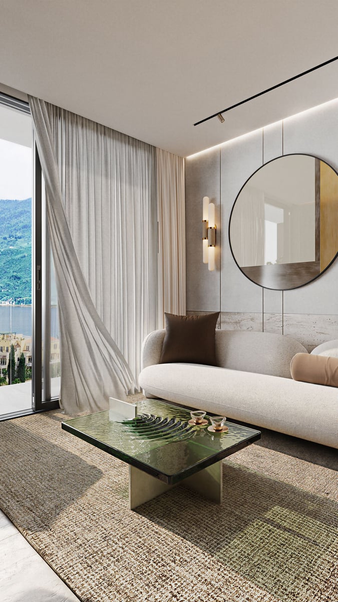 Modern living room in Kumbor residential complex, Montenegro: light sofa, designer coffee table, and sea and mountain views.