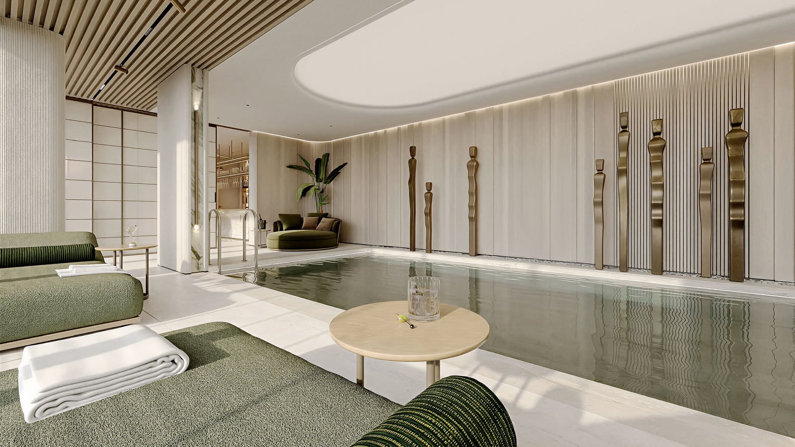 Indoor pool in a luxury residential complex in Kumbor, Montenegro: designer finishes, a lounge area with sun loungers, and wall decor.
