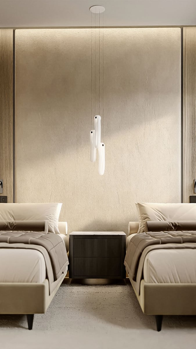 Modern bedroom in ЖК Кумбор, Montenegro: two beds, a designer chandelier, and beige-toned finishes.