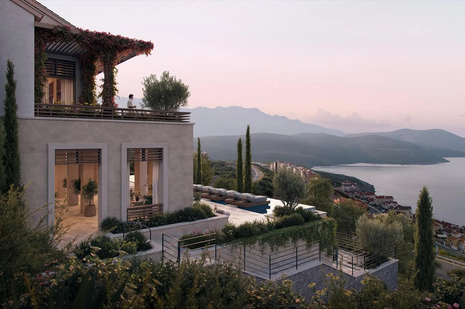Luxury villa in Luštica, Montenegro: terrace with pool, panoramic sea and mountain views, stone facade finish.