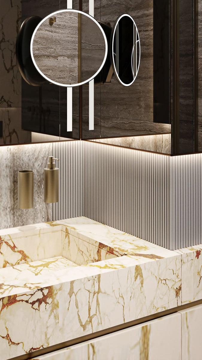 Designer bathroom in the Kumbor residential complex, Montenegro: marble sink, backlit mirror, and fluted wall finish.