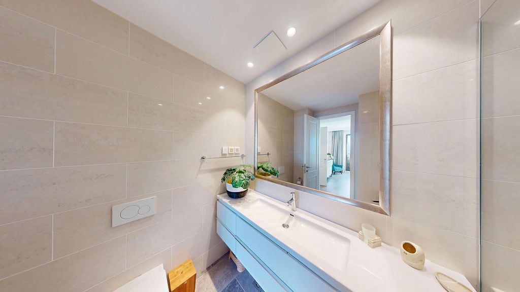 Modern bathroom with a shower and light finishes in an apartment, Luštica, Montenegro.