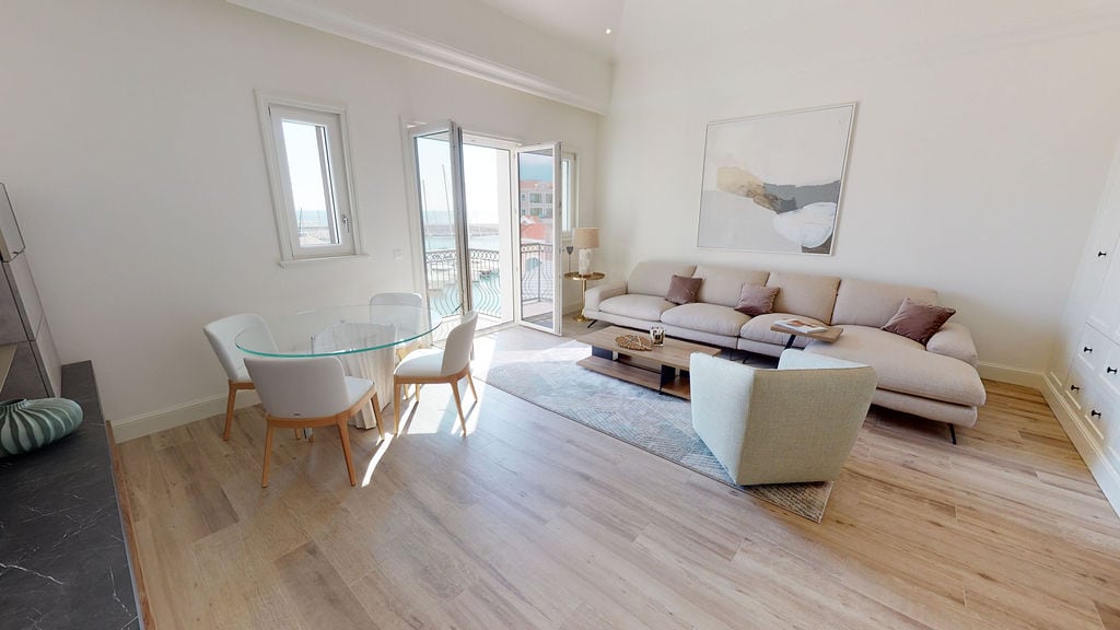 Bright living room with modern furniture and a view of the marina in the elite residential complex Luštica, Montenegro.