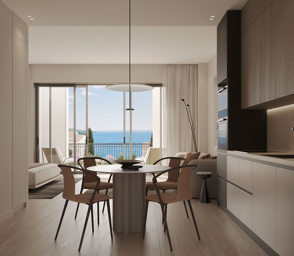 Modern living room with kitchen in Luštica, Montenegro: panoramic sea view, stylish furniture, and terrace.