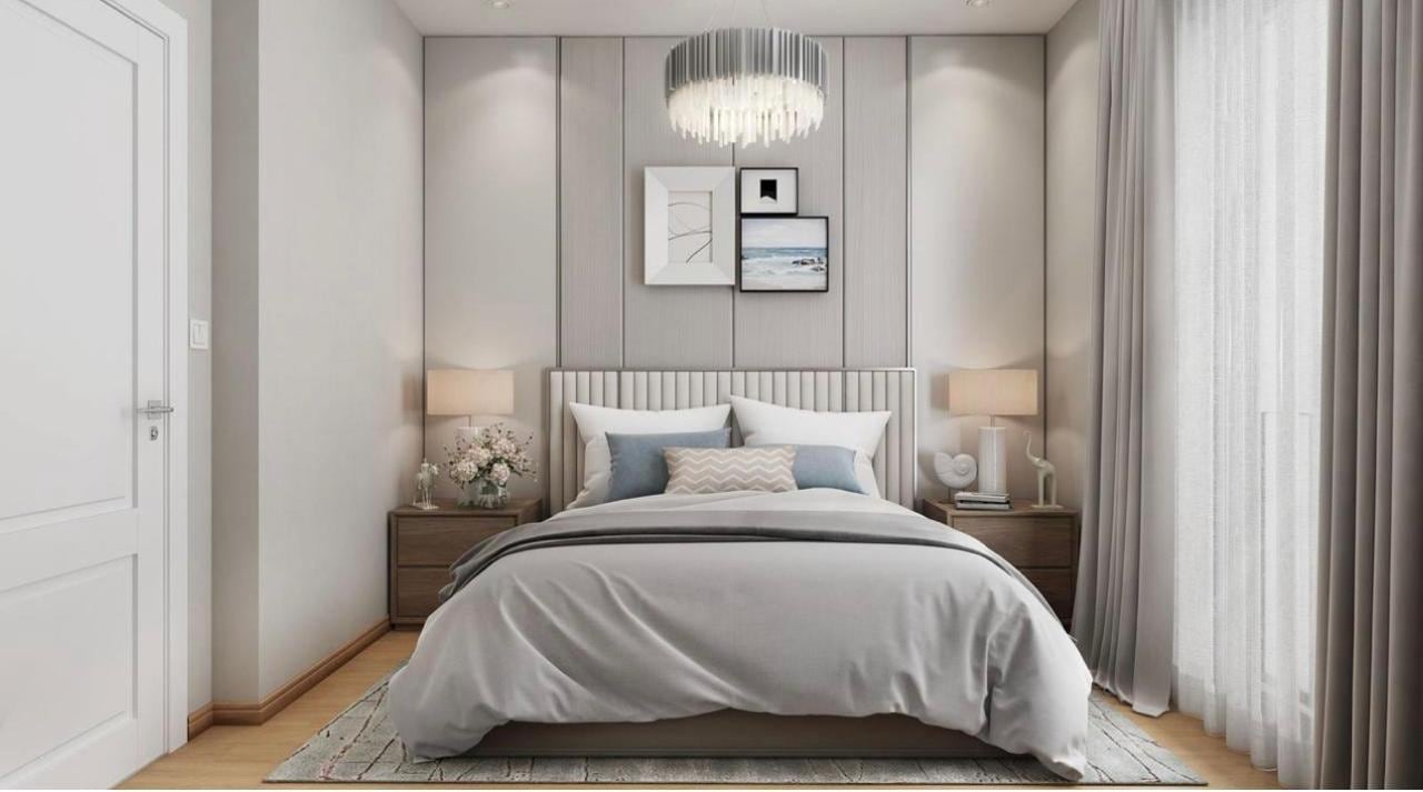 Modern bedroom in light tones with a double bed in the Herceg Novi residential complex, Montenegro: stylish interior and decor.
