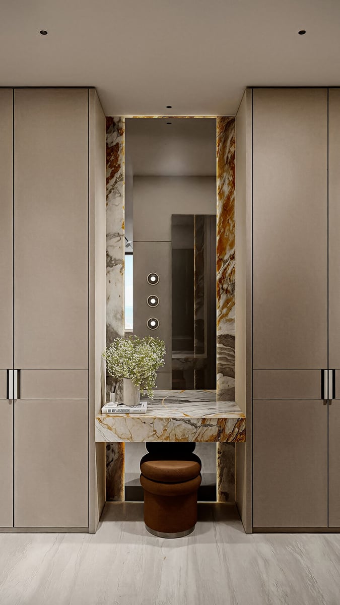 Designer marble vanity table with mirror and lighting in the bedroom of a luxury apartment in Kumbor, Montenegro.