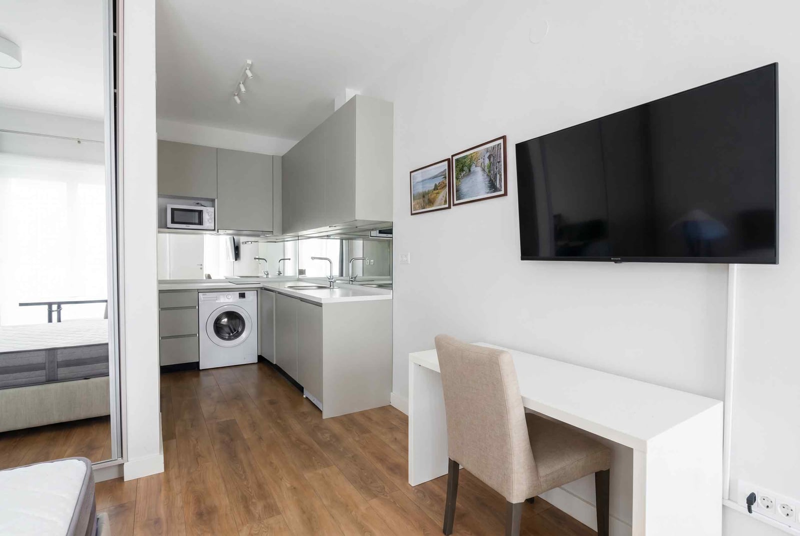 Modern kitchen-studio in an apartment, Kavač, Montenegro: built-in appliances, stylish interior, and work area.