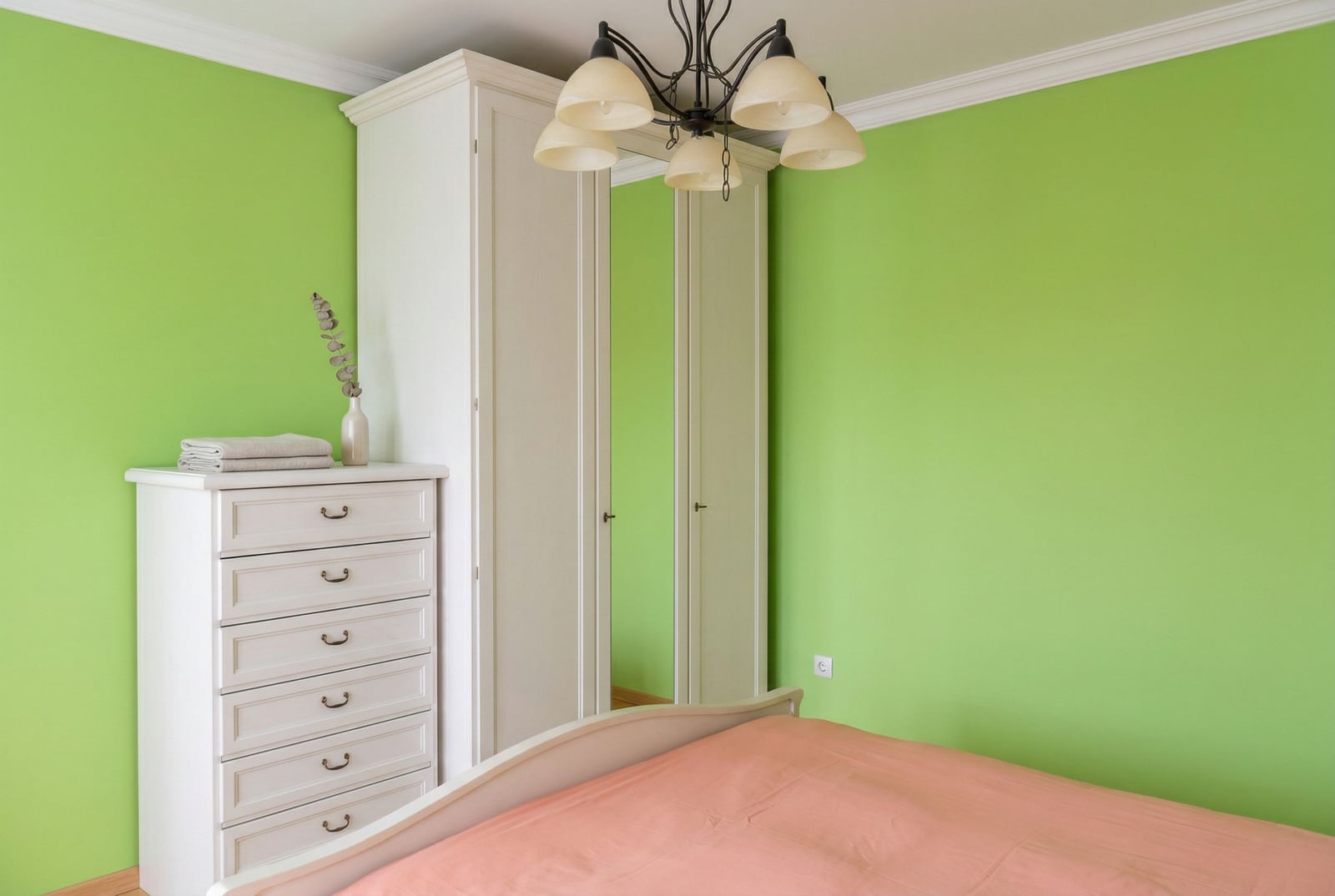 Bedroom with white furniture and green walls in a house for sale, Herceg Novi, Montenegro.