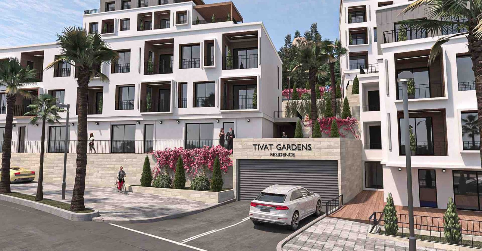 Modern residential complex Tivat Gardens in Tivat, Montenegro: building facade with terraces, palm trees, and parking.