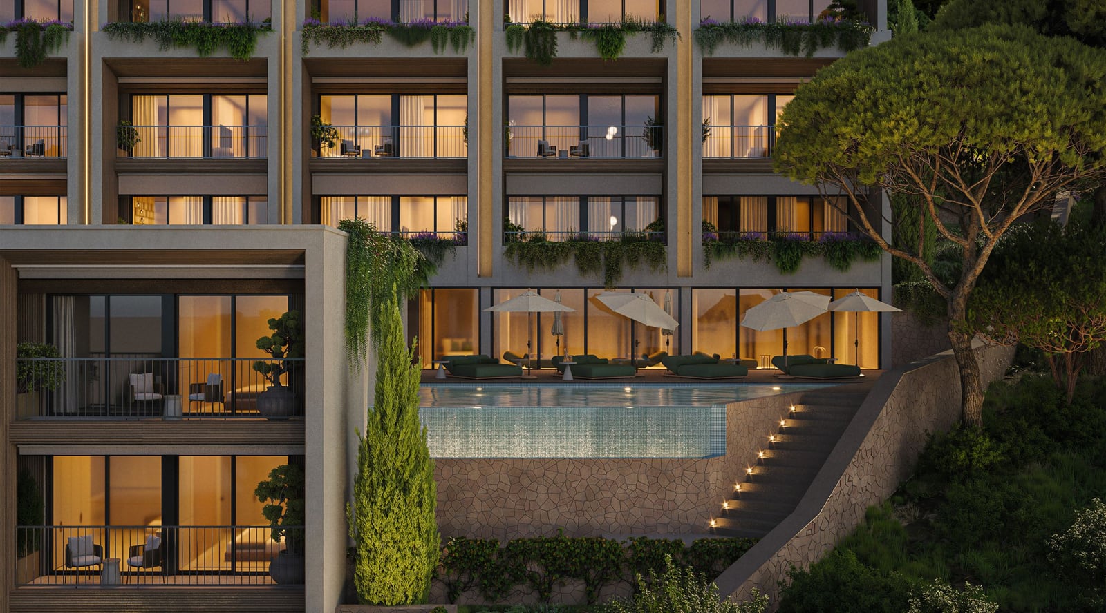 Modern residential complex in Kumbor, Montenegro: a lit swimming pool, landscaped terraces, and panoramic windows.