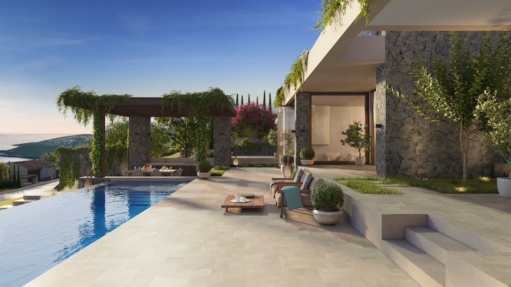 Modern villa in Luštica, Montenegro: infinity pool, stone facade finish, and terrace with sea view.