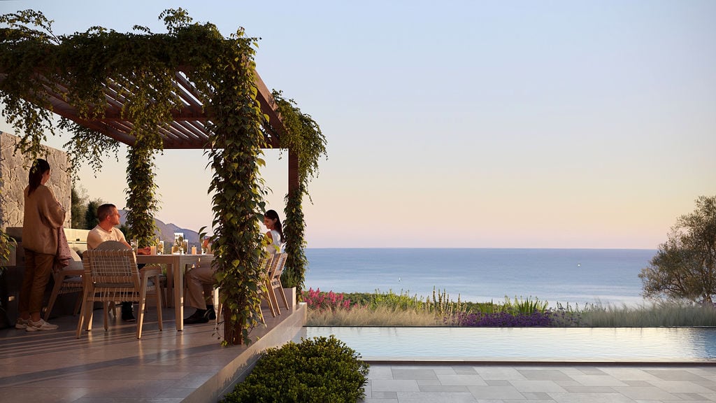 Townhouse terrace in Luštica, Montenegro: pergola with greenery, dining area, and panoramic view of the sea and pool.