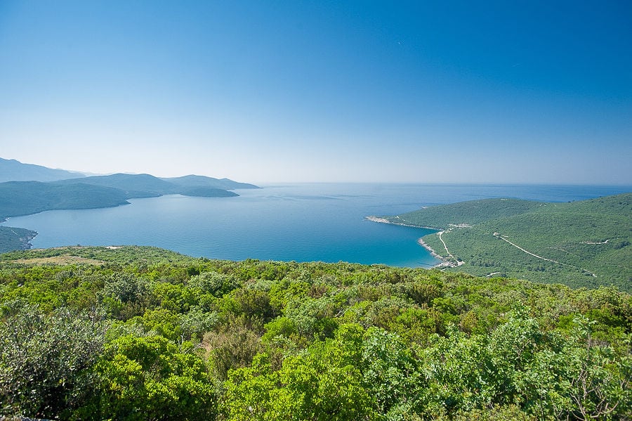 Panoramic view of the Adriatic Sea and the green hills of the Luštica Peninsula, Montenegro, from a residential complex.
