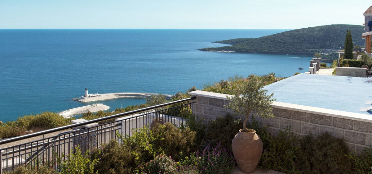 Panoramic view of the sea and marina from the pool of an elite residential complex in Luštica, Montenegro.