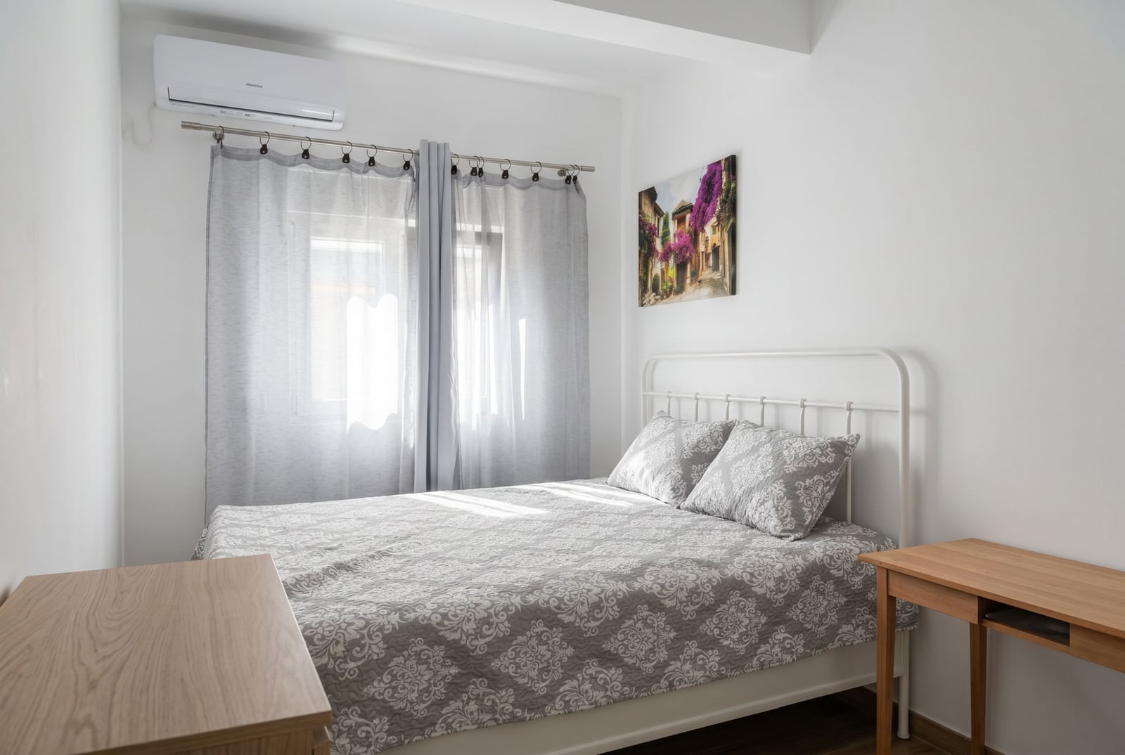Bright bedroom with a double bed and air conditioning in an apartment in Herceg Novi, Montenegro.