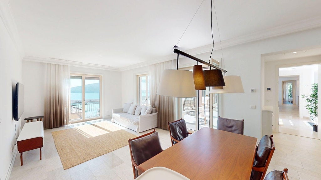 Bright living room with a dining area and sea view in the elite residential complex Luštica, Montenegro.