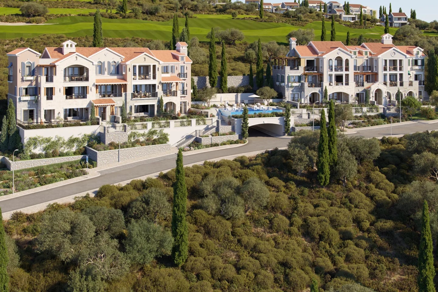Luxury residential complex with a pool in Luštica, Montenegro: view of Mediterranean-style villas and a landscaped park.