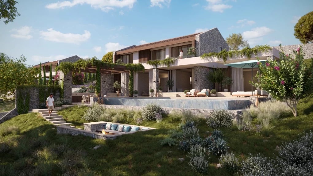 Modern villa in Luštica, Montenegro: stone finishing, infinity pool, terrace with lounge area and fireplace in the garden.