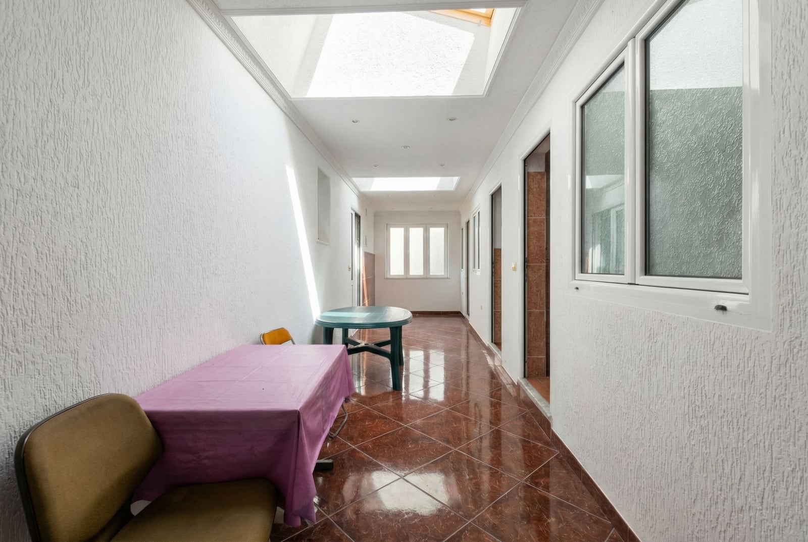 Bright hallway with skylights and tiled floor in a house for sale, Herceg Novi, Montenegro.