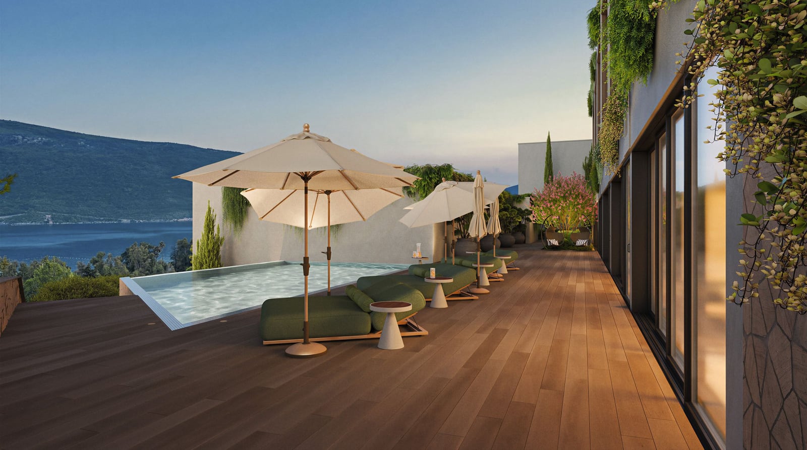 Terrace with a pool and sun loungers in a residential complex in Kumbor, Herceg Novi, Montenegro: sea and mountain views, modern design.