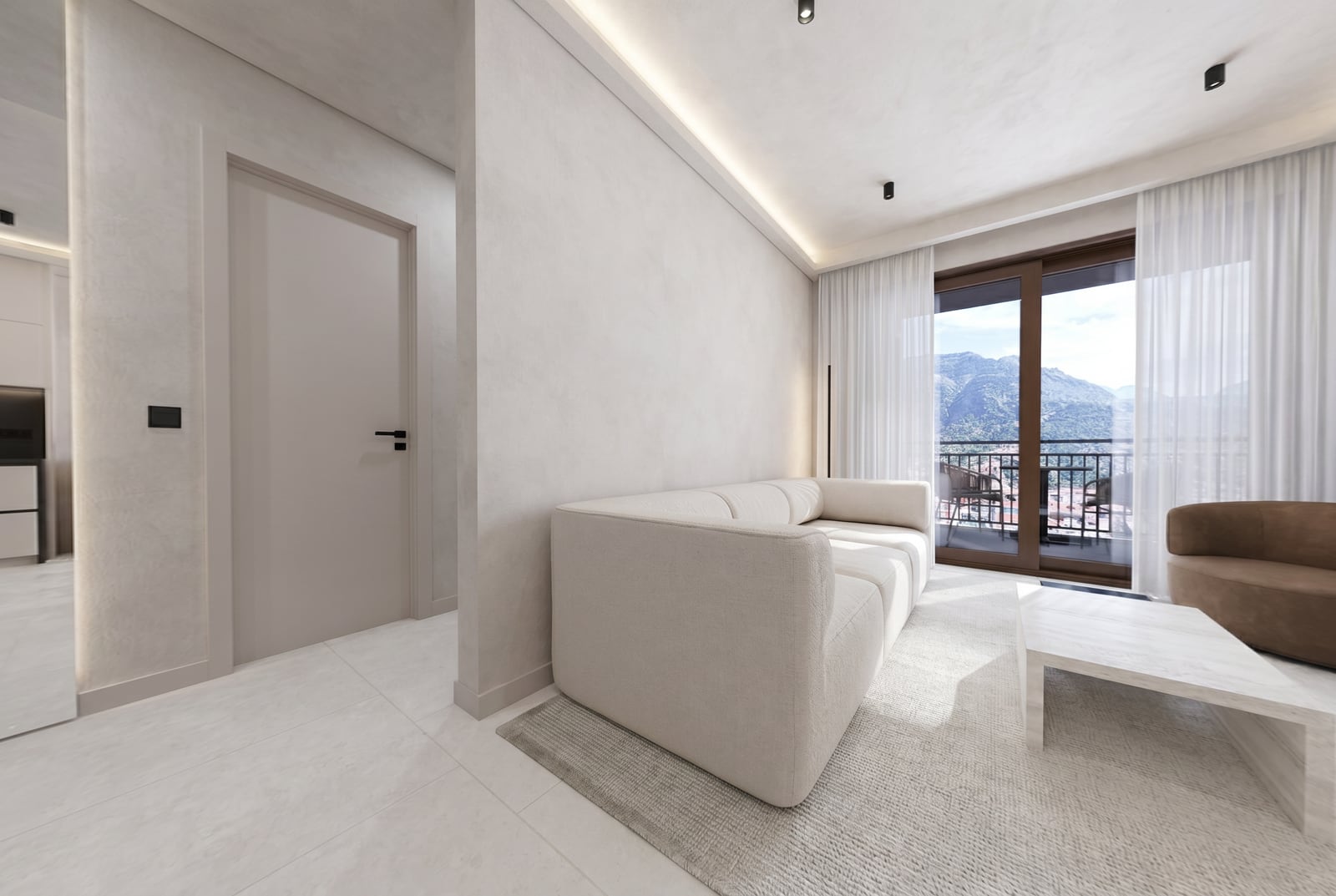 Modern living room in the Tivat residential complex, Montenegro: bright interior, soft sofa, and a balcony with a mountain view.